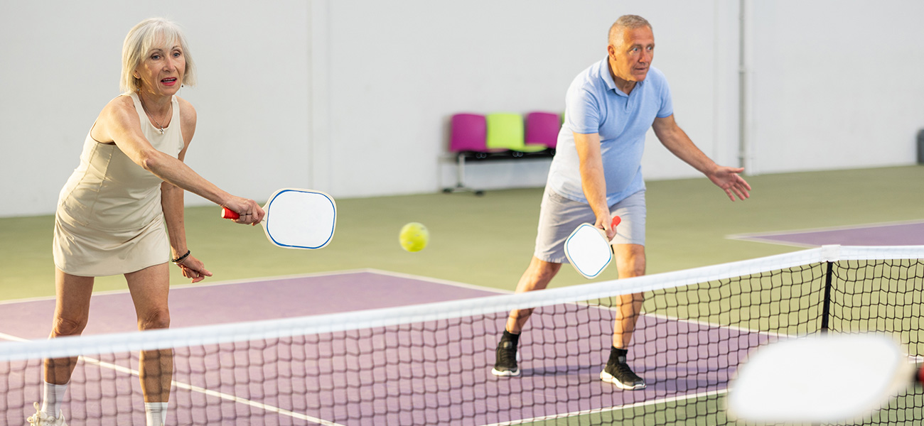 Couple playing pickleball