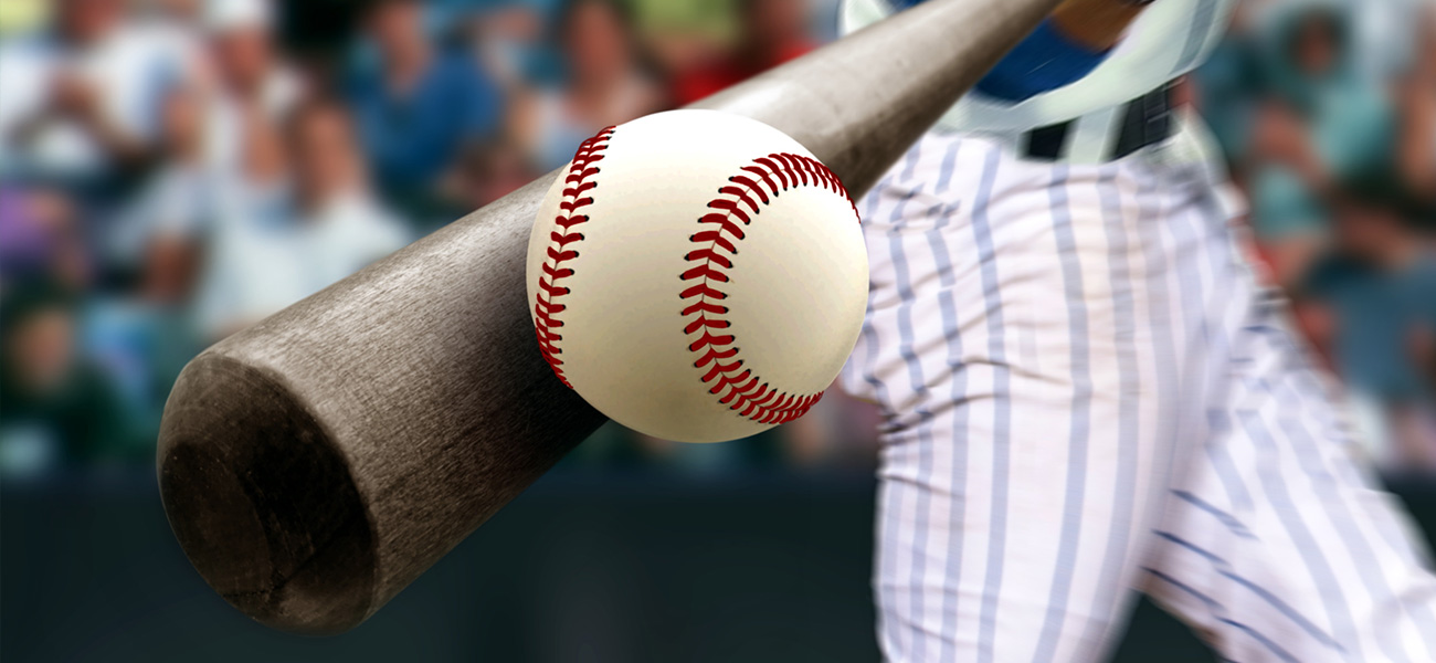 Baseball player hits ball