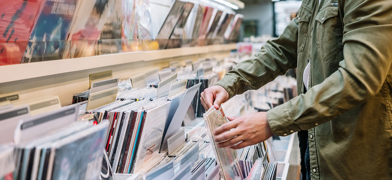 Person looking through records.